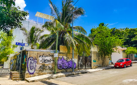 Typical street road and cityscape of La Quinta Avenida with restaurants shops stores people souvenirs and building in Playa del Carmen Playa del Carmen Quintana Roo Mexico.のeditorial素材
