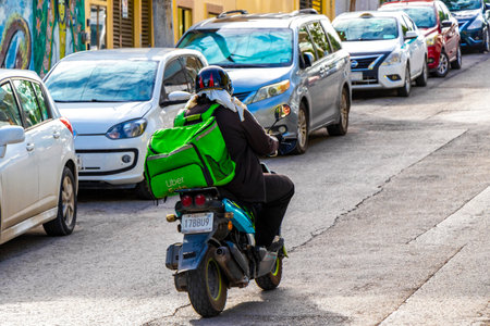 Various motorcycles mopeds bikes and scooters in Playa del Carmen Quintana Roo Mexico.のeditorial素材