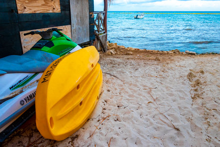 Hire a jet ski and enjoy water sports on the Caribbean beach in Playa del Carmen Quintana Roo Mexico.のeditorial素材