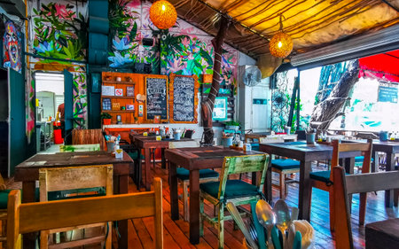 Playa del Carmen Quintana Roo Mexico August 30, 2023 Tables, chairs and visitors inside the restaurant in Playa del Carmen Quintana Roo Mexico.のeditorial素材