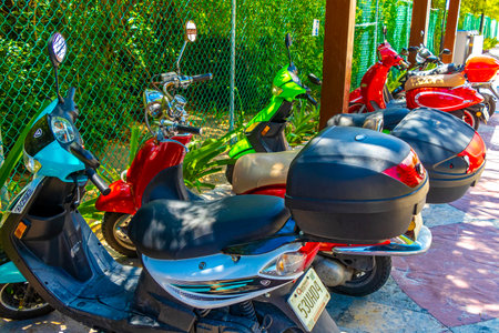 Various motorcycles mopeds bikes and scooters in Playa del Carmen Quintana Roo Mexico.のeditorial素材