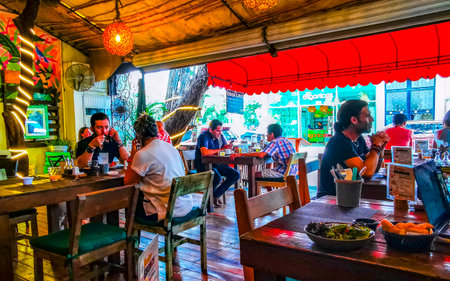 Playa del Carmen Quintana Roo Mexico August 30, 2023 Tables, chairs and visitors inside the restaurant in Playa del Carmen Quintana Roo Mexico.のeditorial素材