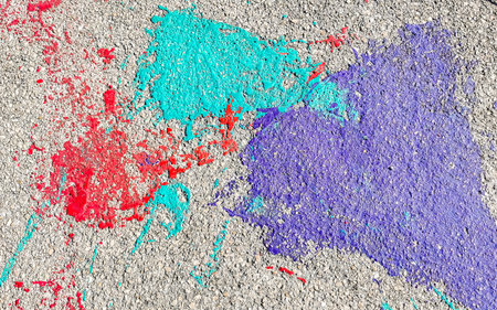 Colorful splashes of paint on the floor on the street texture in Playa del Carmen Quintana Roo Mexico.の写真素材