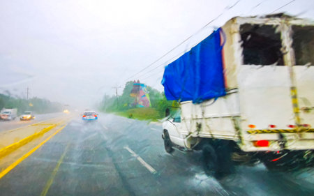 Playa del Carmen Quintana Roo Mexico August 21, 2023 Driving on highway in car through tropical storm rain extreme flood and hurricane in Playa del Carmen Quintana Roo Mexico.のeditorial素材