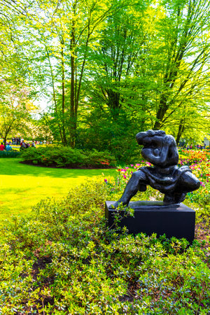 Lisse South Holland Netherlands April 4, 2014 Metal and wooden statue sculpture figure in the park in Keukenhof Lisse South Holland Netherlands Holland in Europe.のeditorial素材