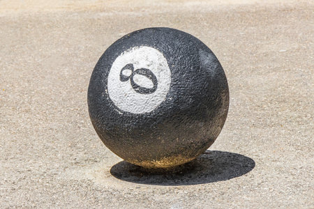 Decorative stone rock cement balls with graffiti painting on sidewalks in Playa del Carmen Mexico.