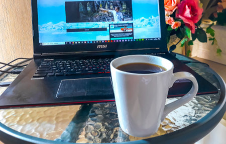 Pattaya Chon Buri Thailand October 26, 2018 Laptop computer and coffee on a table in Pattaya Bang Lamung Amphoe Chon Buri Thailand in Southeastasia Asia.のeditorial素材