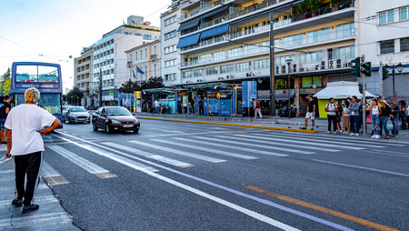 Athens Attica Greece October 4th 2018 Typical street road buildings cars and palm trees in Greece's capital Athens in Greece.のeditorial素材