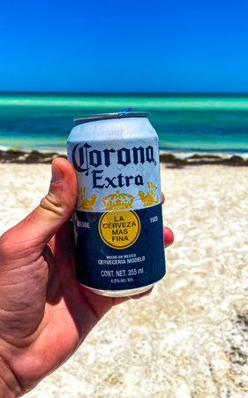Holbox island in Quintana Roo Mexico May 17, 2022 Drinking a can of cold beer Corona Extra on the beach in paradise on Isla Holbox island in Quintana Roo Mexico.のeditorial素材