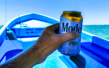 Holbox island in Quintana Roo Mexico May 16, 2022 Drinking a can of cold beer Modelo Especial on the...