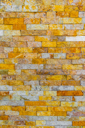 Yellow orange bricks of a wall texture pattern in Playa del Carmen Quintana Roo Mexico.の写真素材
