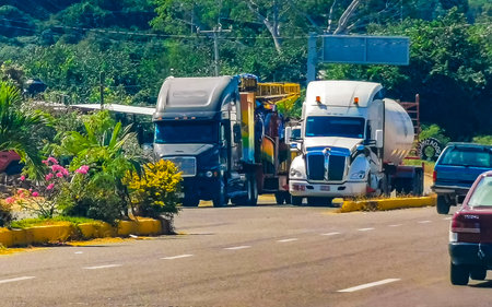 Mazunte Oaxaca Mexico November 23, 2023 Truck trucks car cars vehicle vehicles transportation delivery dump on highway in Mazunte Oaxaca Mexico.のeditorial素材