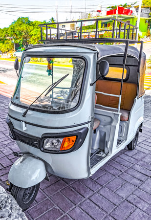 Puerto Escondido Oaxaca Mexico January 29, 2023 White tuk tuk tricycle TukTuks rickshaw in Zicatela...