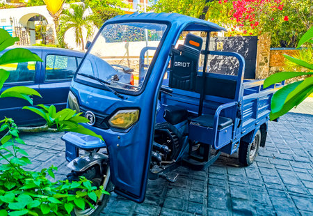 Puerto Escondido Oaxaca Mexico March 24, 2023 Blue tuk tuk tricycle TukTuks rickshaw in Zicatela...