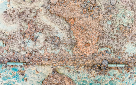 Old cracked blue painted wall with sloping sections in Zicatela Puerto Escondido Oaxaca Mexico.