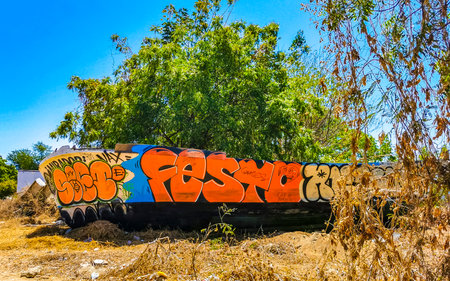 Colorful graffiti art paintings on a wall in Puerto Escondido, Oaxaca, Mexico.のeditorial素材