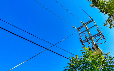 Power pole cable box with blue sky in Zicatela Puerto Escondido Oaxaca Mexico.