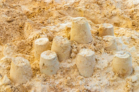 Castle made of white sand with buckets on the beach in Playa del Carmen Quintana Roo Mexico.