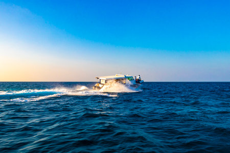 Motor engine of a speedboat in the blue turquoise water on Rasdhoo island in Rasdhoo Atoll Maldives.