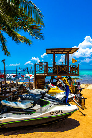 Hire a jet ski and enjoy water sports on the Caribbean beach in Playa del Carmen Quintana Roo Mexico.のeditorial素材
