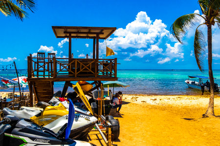 Hire a jet ski and enjoy water sports on the Caribbean beach in Playa del Carmen Quintana Roo Mexico.のeditorial素材