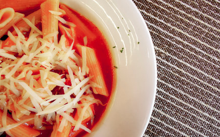 White plate of tasty pasta florentine noodles meal dish food and drink in the restaurant PapaCharly...