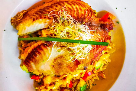 Grilled fish on rice vegetables and chipotle sauce dish meal in Playa del Carmen Quintana Roo...