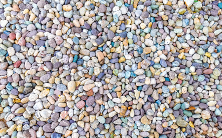 Texture detail of many colorful little stones rock in Zicatela Puerto Escondido Oaxaca Mexico.の写真素材