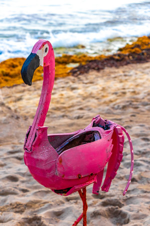 Pink flamingo decorative figure on the beach statue in Playa del Carmen Quintana Roo Mexico.の写真素材