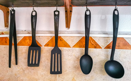 Hanging kitchen utensils kitchenware with shelf in Playa del Carmen Quintana Roo Mexico.の写真素材