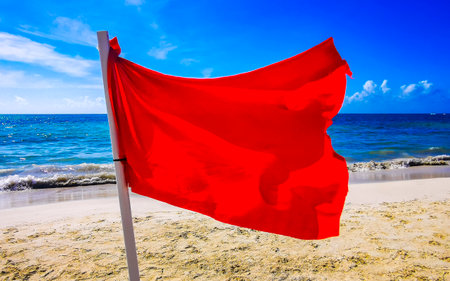 Red flag swimming prohibited high waves in Playa del Carmen Quintana Roo Mexico.の写真素材