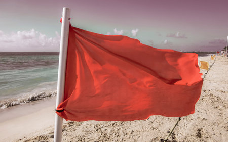 Red flag swimming prohibited high waves in Playa del Carmen Quintana Roo Mexico.の写真素材