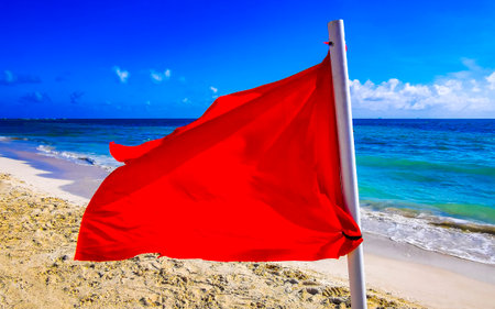 Red flag swimming prohibited high waves in Playa del Carmen Quintana Roo Mexico.の写真素材
