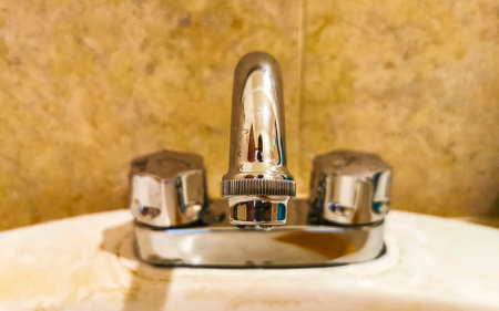 Stylish decorative faucet and washbasin in the bathroom.の写真素材