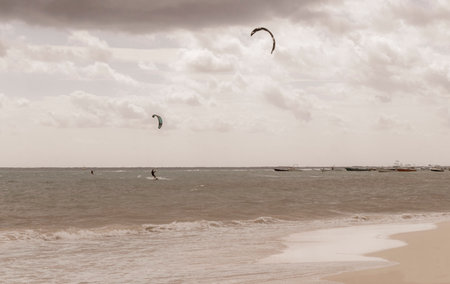 Playa del Carmen Quintana Roo Mexico November 29, 2023 Water sport like kitesurfing kiteboarding wakeboarding on tropical Mexican beach in Playa del Carmen Mexico.の写真素材