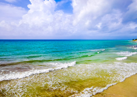Amazing tropical Mexican Caribbean beach and sea landscape panorama with clear turquoise blue water waves and white sand.の写真素材