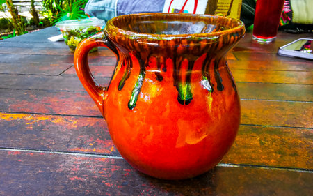 Glass pot cup of americano black coffee with spoon and plate on a table food and drink in the restaurant cafe in Playa del Carmen Quintana Roo Mexico.の写真素材