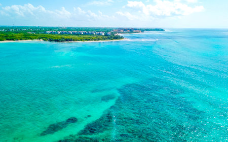 Coral reef sea seascape and Caribbean beach and tropical jungle panorama with turquoise green and blue water in Playa del Carmen Quintana Roo Mexico.の写真素材