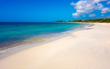 Amazing tropical Mexican Caribbean beach and sea landscape panorama with clear turquoise blue water waves and white sand.の写真素材