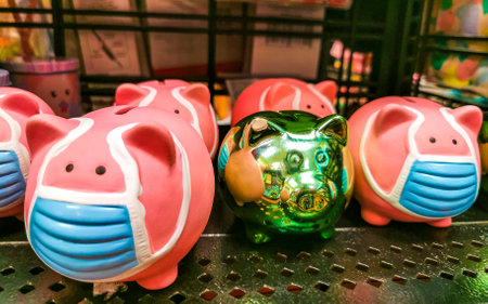 Piggy bank with medical protective face mask in Playa del Carmen Quintana Roo Mexico.の写真素材