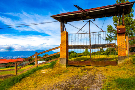 Typical farmhouse with garden in a mountain village in Para Heredia Costa Rica in Central America.