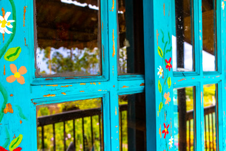 Turquoise blue door of a wooden house in Para Heredia Costa Rica.