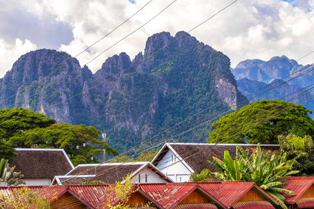 Mountain peak landscape with tropical forest jungle hills rocks and walking hiking path street road in Vang Vieng Vientiane Province Laos in Southeastasia Asia.の写真素材