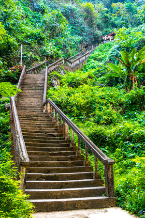 Staircase stairs and hiking walking path way up to Tham Chang Jang karst cave in Vang Vieng...