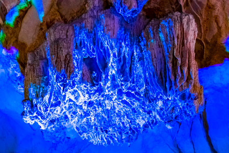 Tham Chang Jang karst cave with limestone rocks with light and illumination in Vang Vieng Vientiane Province Laos in Southeastasia Asia.の写真素材