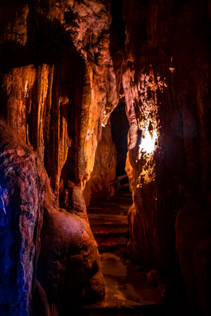 Tham Chang Jang karst cave with limestone rocks with light and illumination in Vang Vieng Vientiane Province Laos in Southeast Asia.の写真素材