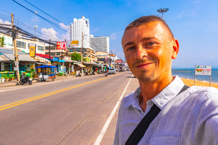 Man takes photo selfie in the city in Pattaya Bang Lamung Amphoe Chon Buri Thailand in Southeast Asia.の写真素材