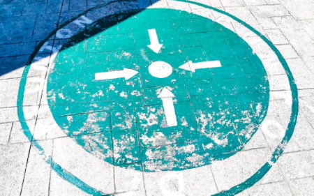 Emergency meeting point green signs assembly point on the road.