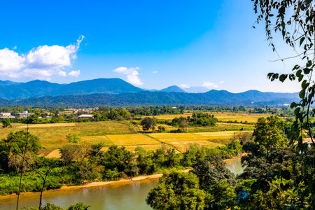 Mountain peak landscape with tropical forest jungle hills rocks and Nam Song river lake water in Vang Vieng Vientiane Province Laos in Southeastasia Asia.の写真素材