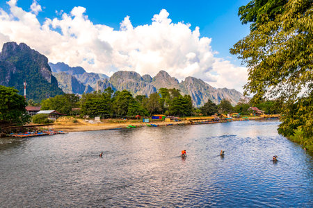 Mountain peak landscape with tropical forest jungle hills rocks and Nam Song river water in Vang Vieng Vientiane Province Laos in Southeastasia Asia.の写真素材